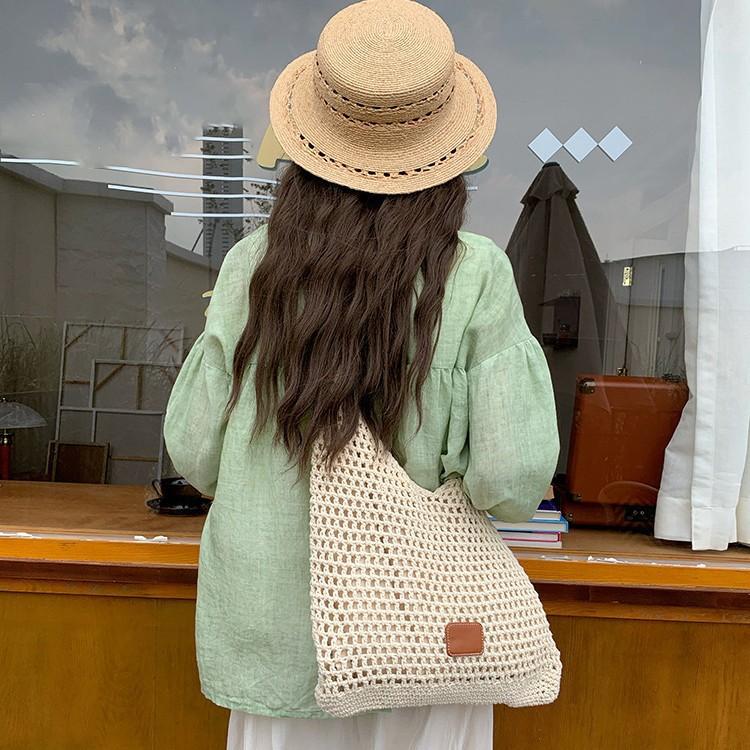 Seaside vacation beach bag weaving 2025 new fashion versatile hollow knitted bag large capacity shoulder armpit bag