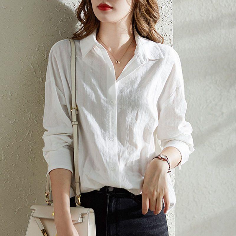 Chemise en coton blanc à manches longues pour femmes Au printemps et en automne Design polyvalent ample et élégant Haut de niche
