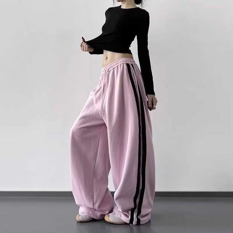 Damskie codzienne spodnie z szerokimi nogawkami, patchwork - czarne, w paski, sportowe