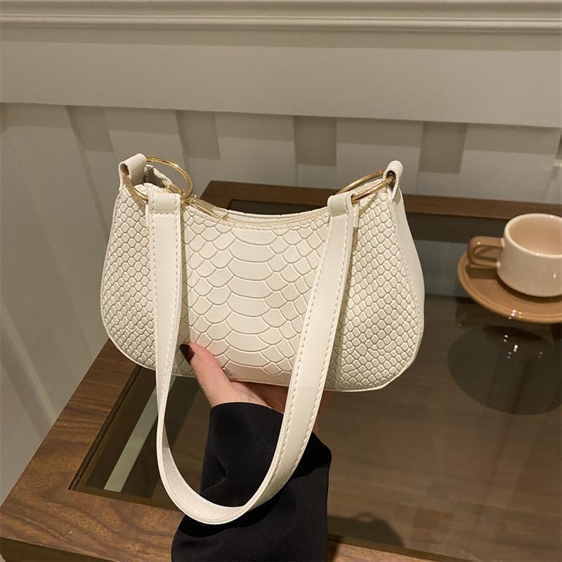 Schicke urbane minimalistische Achseltasche für Damen, vielseitige Herbstmode in den Farben Schwarz, Khaki, Braun und Weiß