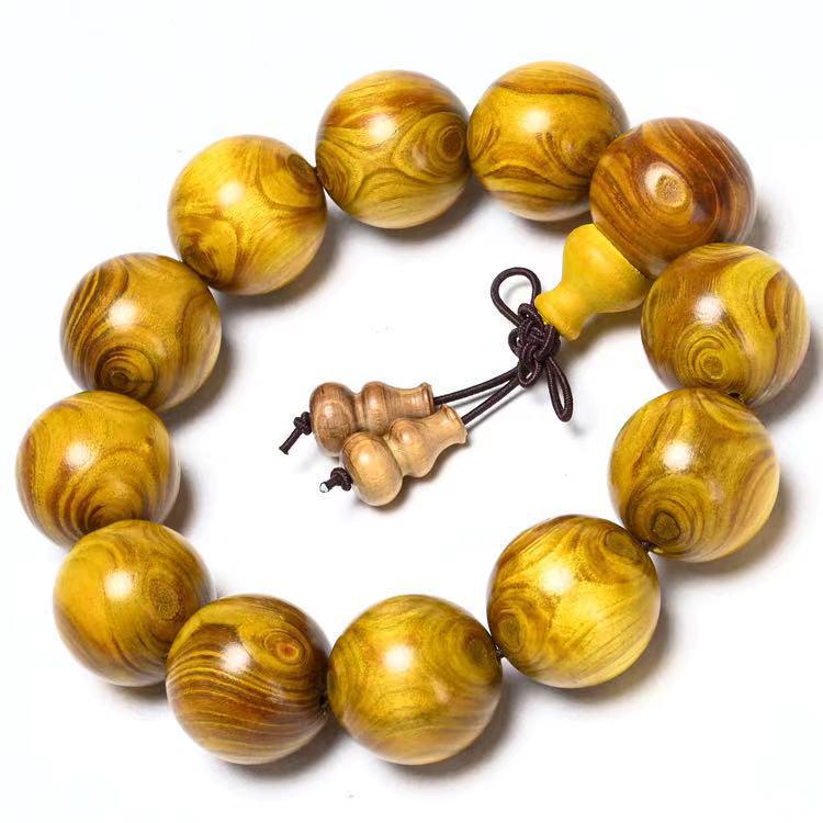 Exquisite Double-Eye Ghost Face Gold Thread Buddhist Bead Bracelet In Premium Wood