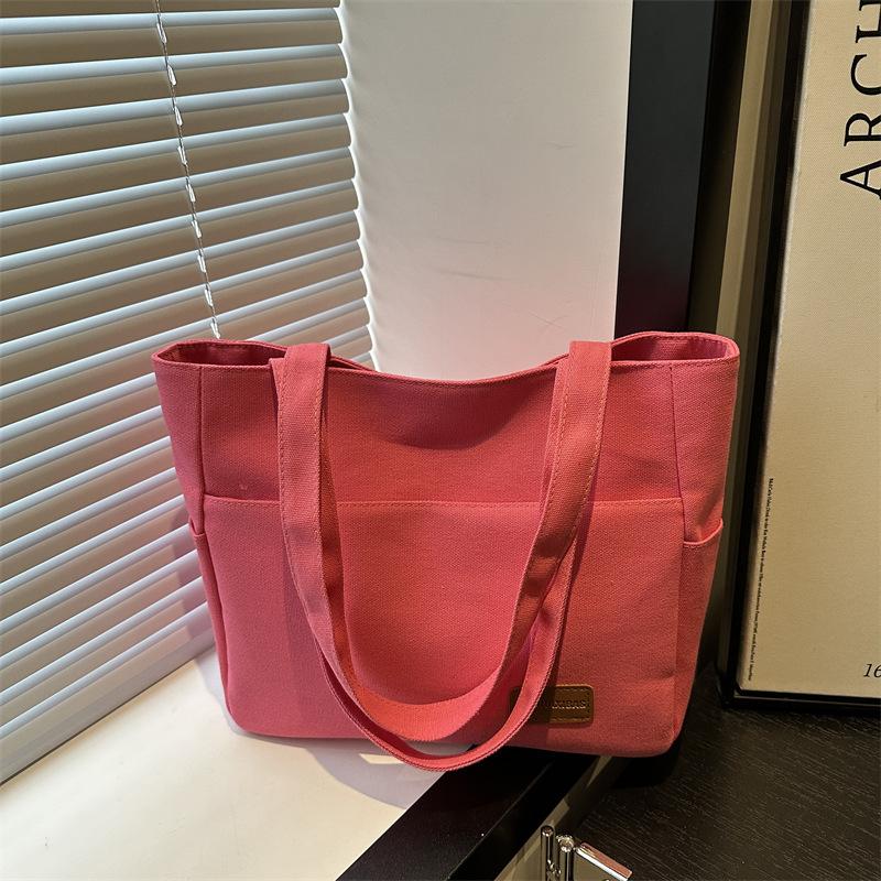 

Сумка женская летняя новая большая вместительная сумка-тоут ретро простая холщовая сумка для通勤 повседневная сумка-мессенджер тренд розовый