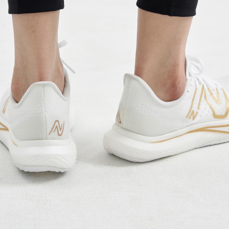 New Balance Women's FuelCell Rebel V3 'White Gold Metallic' Women's Sneakers WFCXMW3
