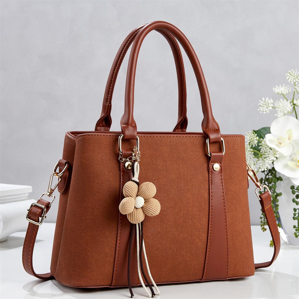 Simple commuting classic flower tassel decorative handbag new gentle temperament crossbody shoulder
