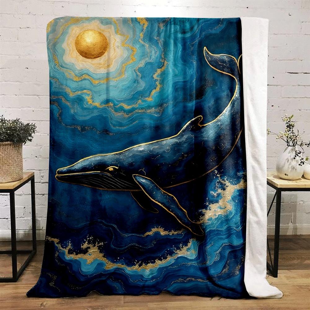 A golden-accented whale swimming in swirling blue waves under a gold sun. for all seasons blanket lunch break throw gift