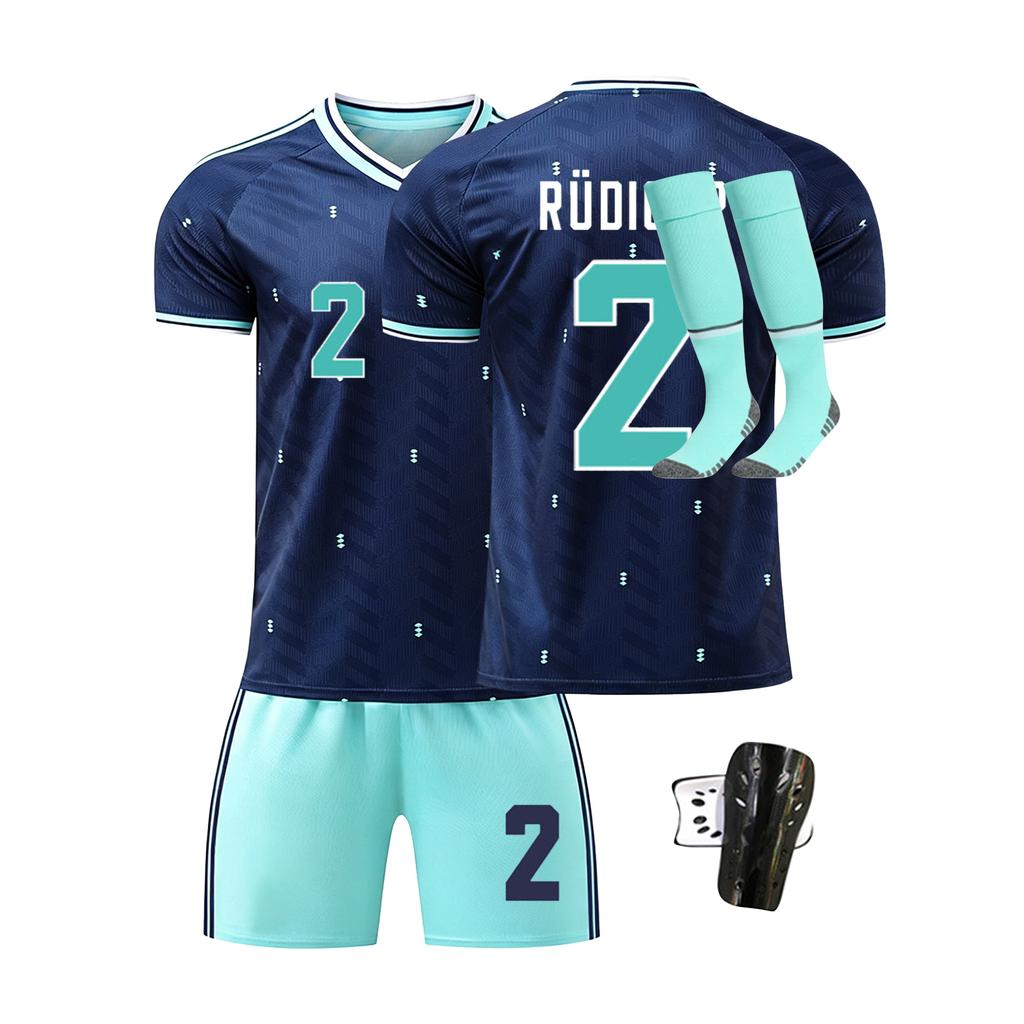 Men's Four Piece Sportswear Set Includes Short Sleeve Jersey Shorts Socks and Shin Guards Suitable for Outdoor and Indoor Activities