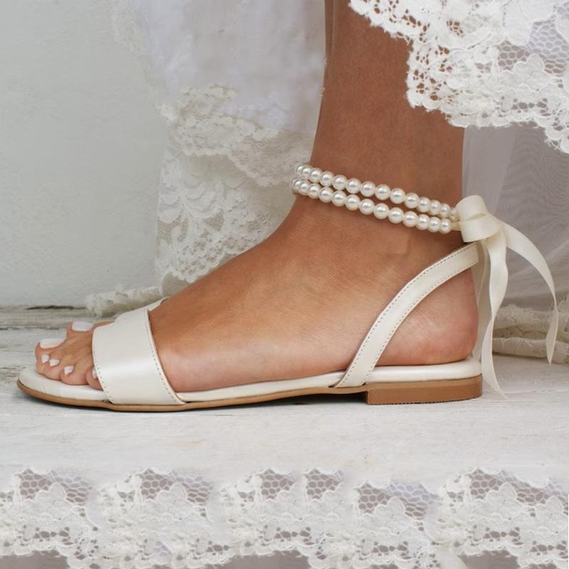 European and American New Spring and Summer Women's Flat Sandals Pearl Ribbon Sexy Foreign Trade White Women's Shoes Classic Wedding Shoes
