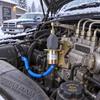 Fuel Shutoff Solenoid 3931570 3923201 with Electrical Socket, Two-Hole Flange, Corrugated Wire Sleeve, and Adjustable Threaded Linkage Assembly
