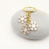 European & American Christmas Snowflake Keychain with Bell Pendant - Creative Alloy Ornament Gift