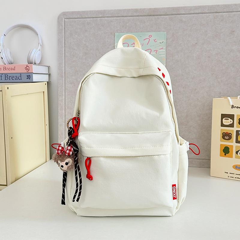 

Japanese schoolbag female college student ins large capacity, simple solid color alphabet backpack male junior high school student backpack single bag