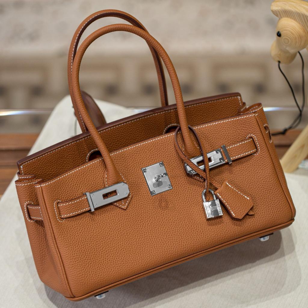 Neue lange Tragetasche Verschluss Silberschnalle Oberleder Rindsleder Mode Ein-Schulter-Handtasche Schloss Schnalle Leder Damen Tasche Handtasche