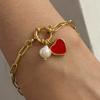 Retro heart-shaped pearl bracelet for women, simple and minimalist, with a stainless steel chain and heart design