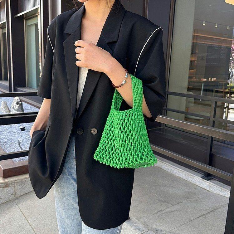 Ausgehöhlte Netzbeutel Handtasche Handgewebte Baumwollseil Tasche Handgelenktasche Strandurlaub Eimertasche