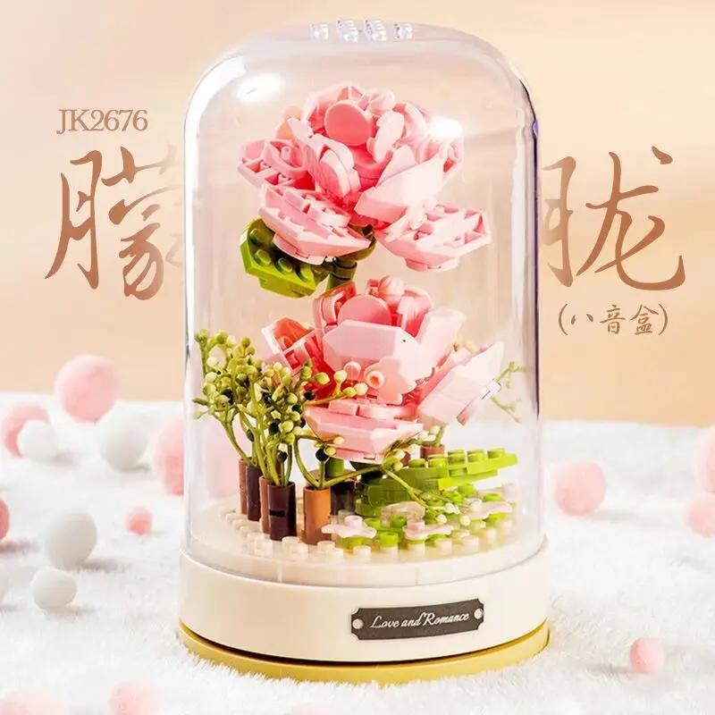 Building blocks music box Clockwork rotating music box Building blocks Rose Lily of the valley puzzle set Valentine's Day gift