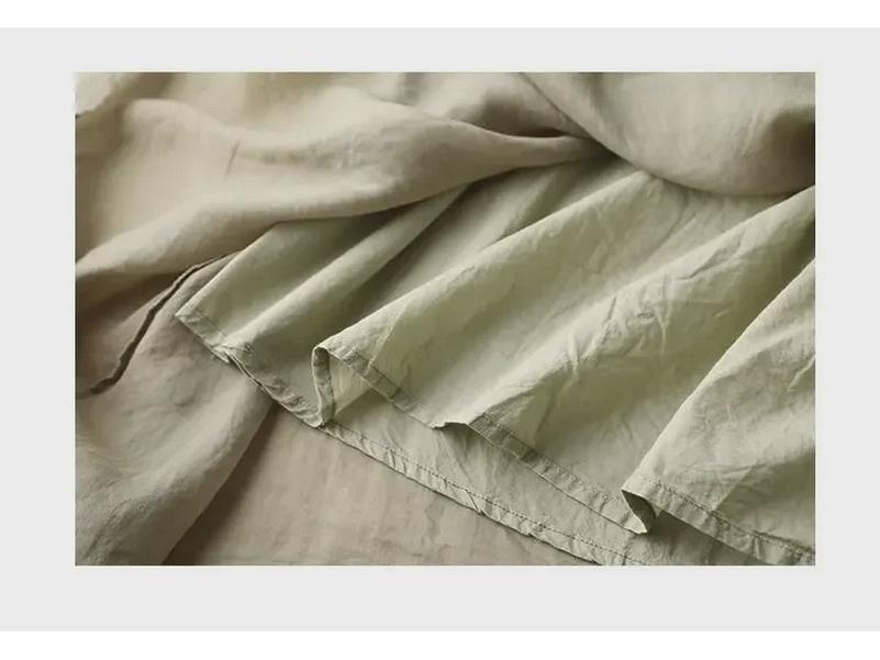 Jupe trapèze taille haute tendance en coton et lin: Mi-long avec bords volantés pour une coupe drapée et amincissante.