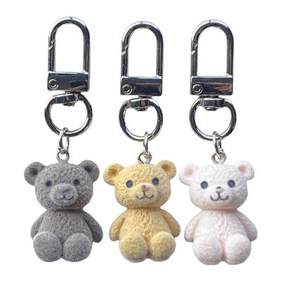 Porte-clés Ours Flocking en Résine Mignon Porte-clés Ours Flocking Adorable Porte-clés Charme de Sac Décoratif Accessoire Pendentif