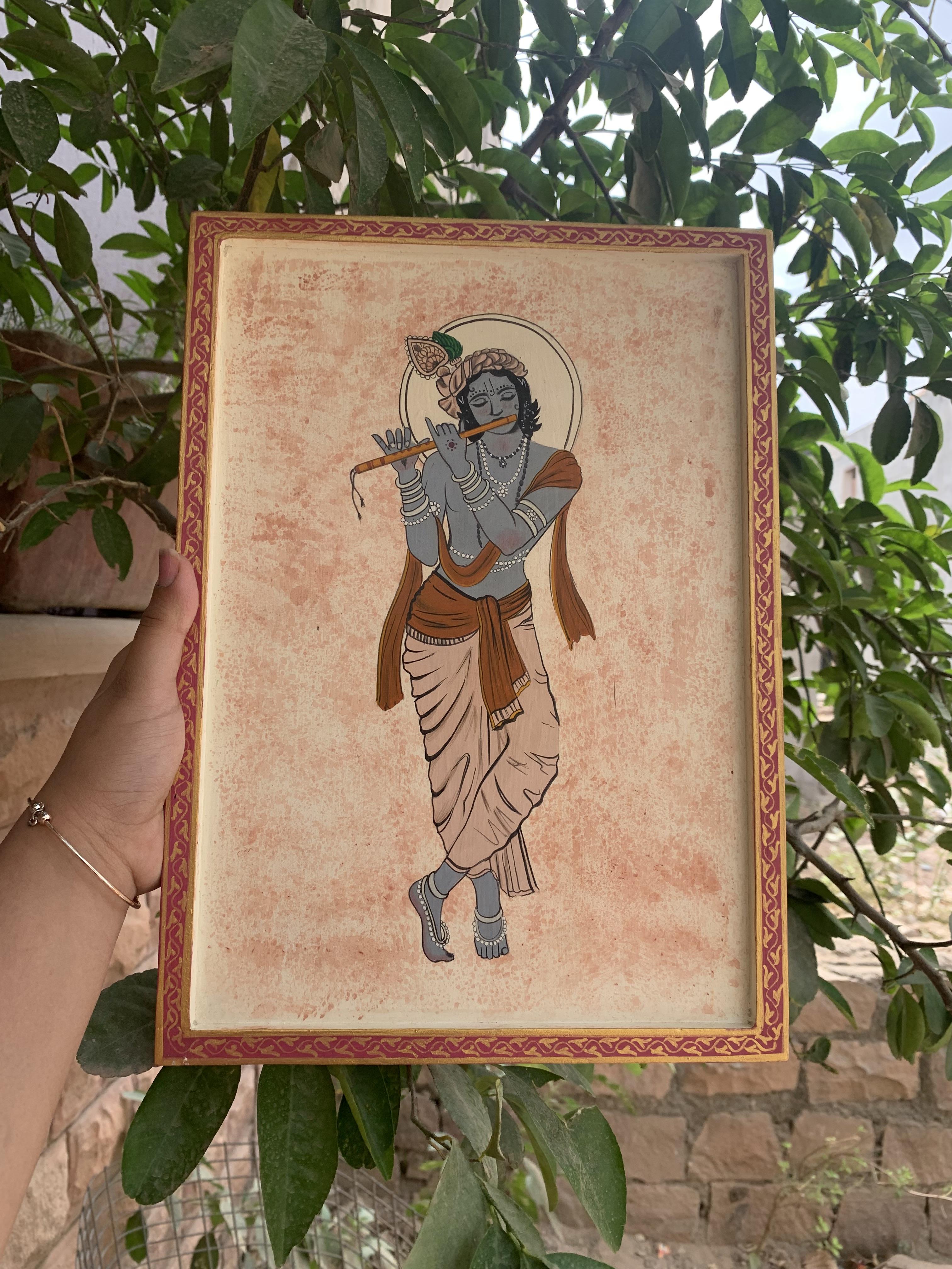 

Handmade Lord Krishna Wall Hanging/Traditional Indian Pichwai Style Painting/Wooden Frame 14” X 1” X 10” ( h x w x l) approx.