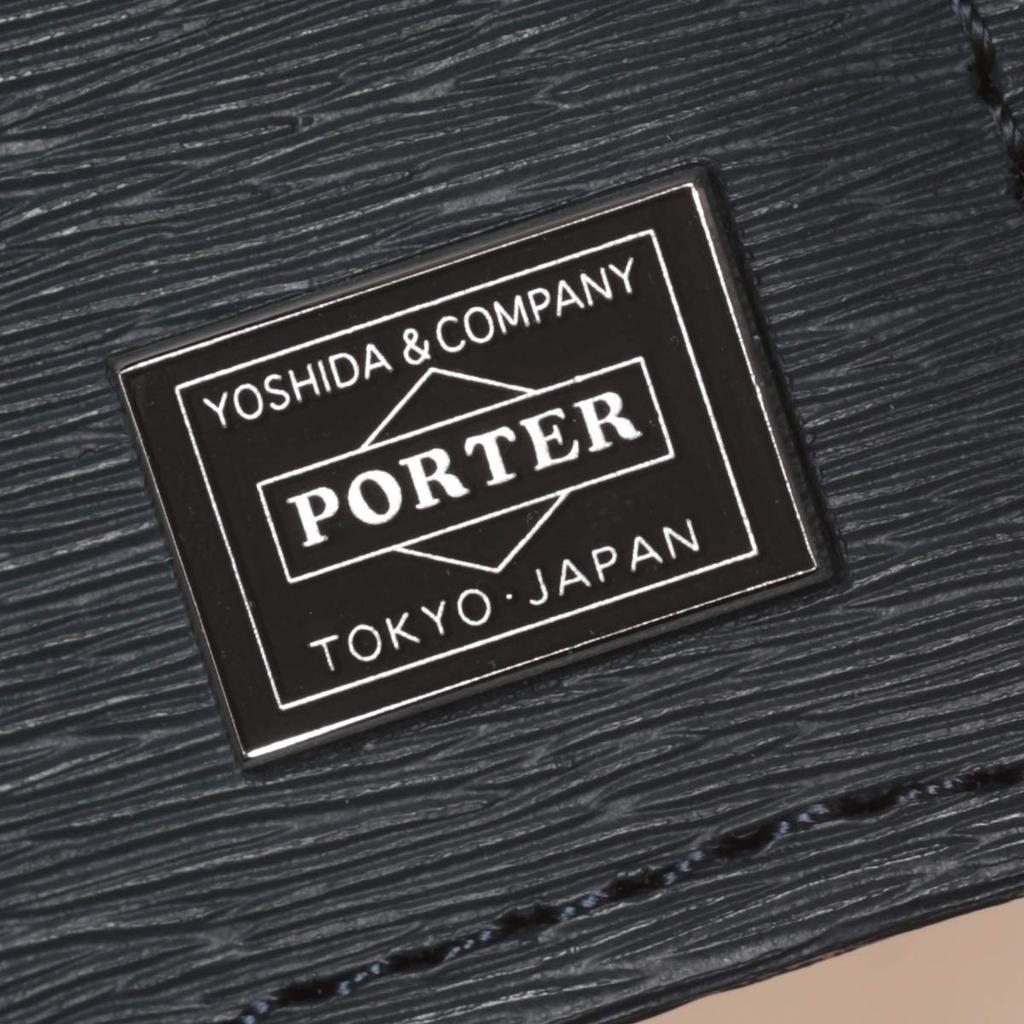 Porter Aktuelles Portemonnaie von Yoshida Dieses und ein einfaches Bifold-Portemonnaie haben kein Münzfach und sind aus Rindsleder mit einer Jacquard-Gerbung Made