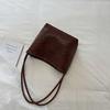 Damen gewebte PU-Eimertasche Minimalistische Umhänge-Handtasche für den täglichen lässigen Einkauf