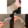 Bracciale di lusso a forma di serpente in rame placcato oro con accenti di zirconi per fashioniste