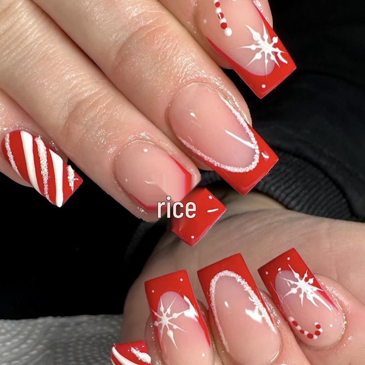 

Red & White Striped Christmas Nails with Snowflake and Candy Cane Design