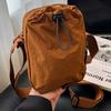 2025 New Japanese and Foreign Style Autumn Drawstring Mobile Phone Bag Simple and Fashionable Commuter Outdoor Leisure Messenger Women's Bag