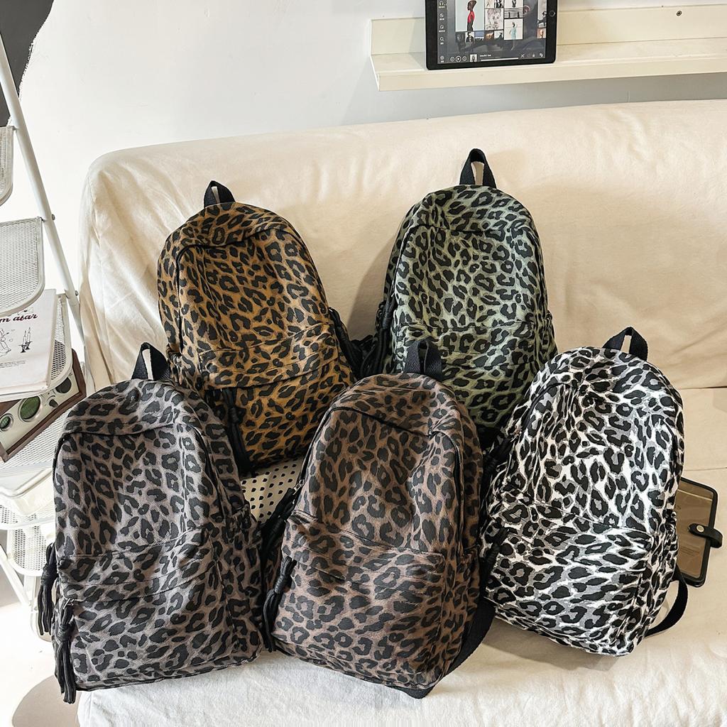 Leopard Print Backpack Casual Daily Use Trendy Street Style Lightweight Backpack for Women with Tassel Detail for School Travel and Everyday Outings
