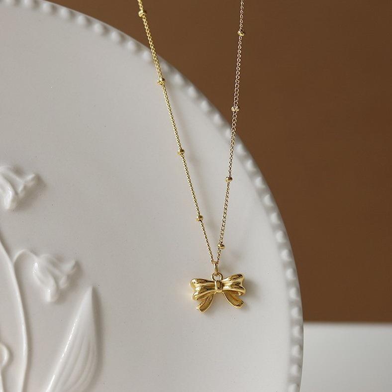 Bow Pearl Beaded Necklace for Women, 18K Gold-Plated Titanium Steel, Clavicle Chain, Simple, Ruyi-Inspired Design.