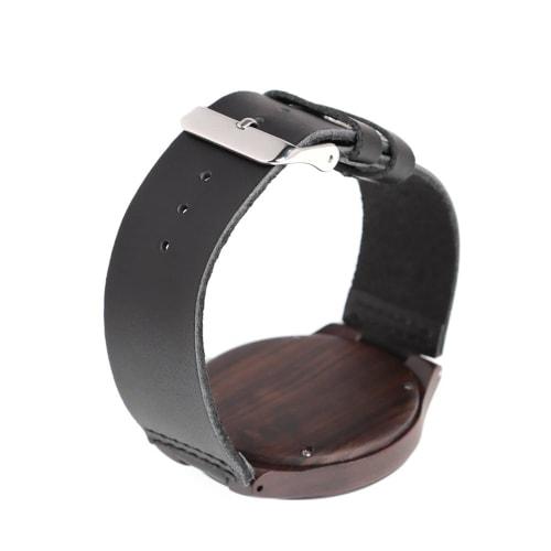 Lightweight wooden watch made of bamboo with analog hands, a Japanese-made movement, a simple dial with a mineral crystal mirror finish, and an adjust