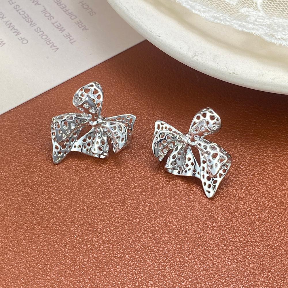 Chic Metal Hollow Bow Earrings: Unique European & American Cool Style