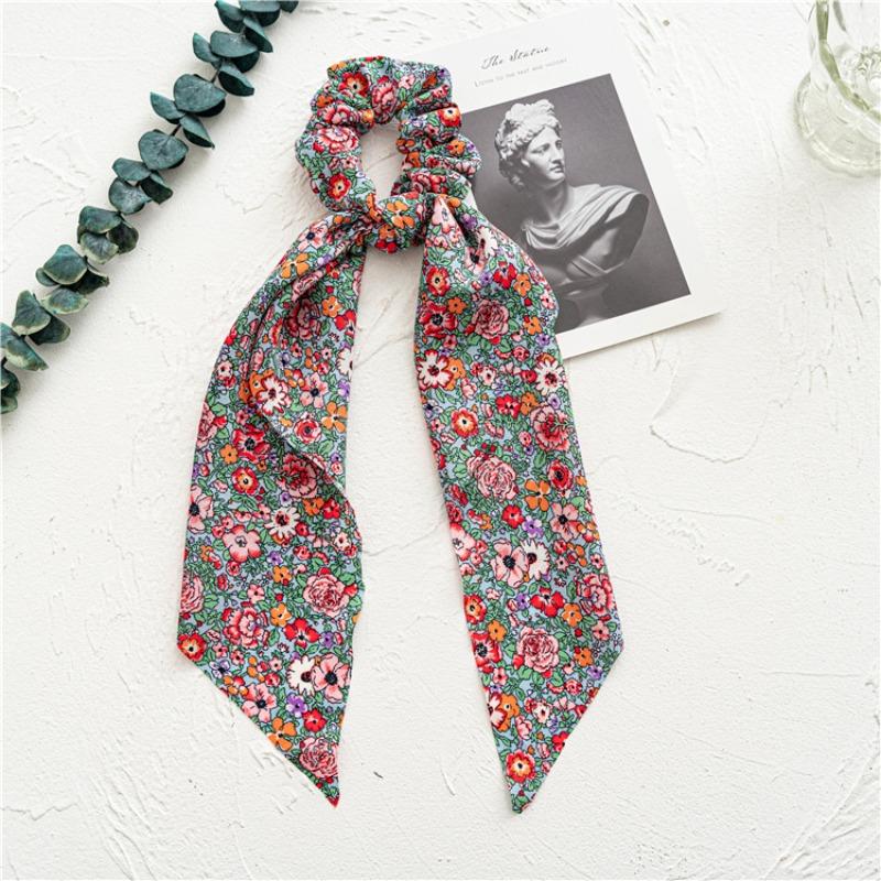 Long flowing ribbon large braided hair accessory for women - ponytail bun hair band with floral design, simple and elegant.