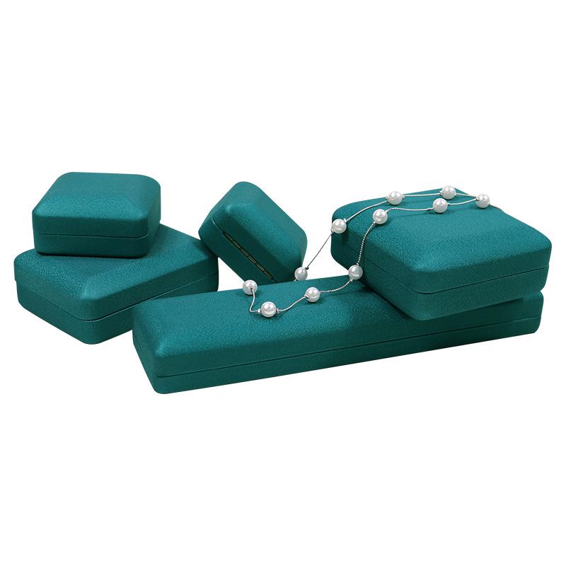 Kulatý roh PU kožená šperkovnice na prsteny, náhrdelníky a náramky