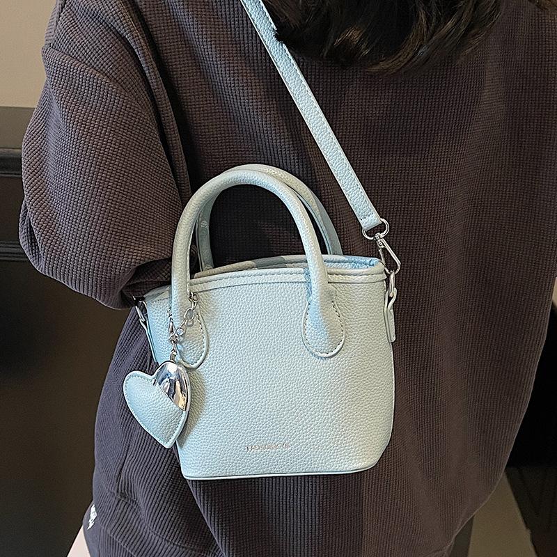 2025 New Fashion High Sense Temperament Simple Hand Carrying Bucket Bag Women's Niche Lychee Pattern Commuter Messenger Bag