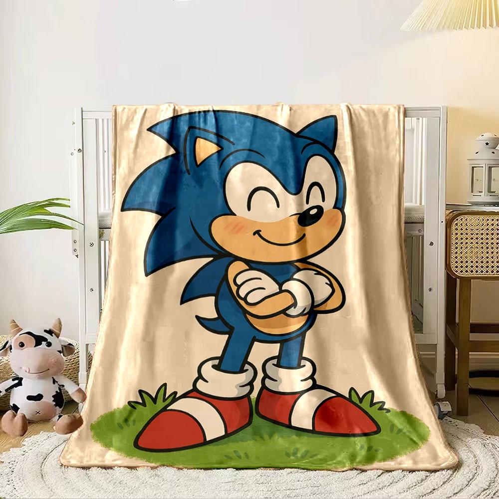 A smiling blue cartoon character with red shoes standing on grass. for all seasons blanket lunch break throw gift 80cm x 120cm