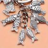Fashionable goldfish pendant keychain, simple and elegant souvenir gift for travelers, perfect for fishing enthusiasm.