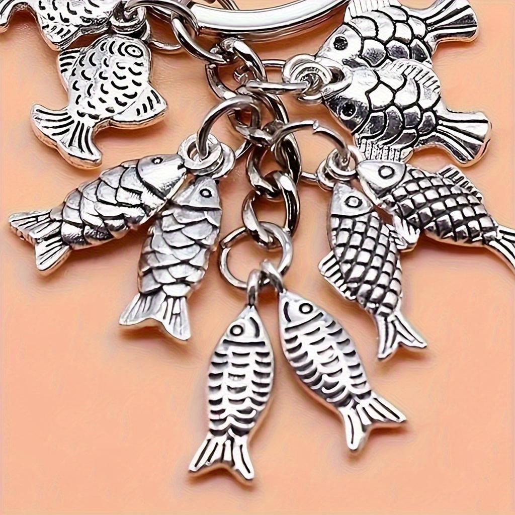 Fashionable goldfish pendant keychain, simple and elegant souvenir gift for travelers, perfect for fishing enthusiasm.