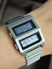 Matching Matrix Retro 1980er Elektronische Digitaluhr Duales LCD-Display Edelstahl Futuristisches Design ODM Zeitmesser