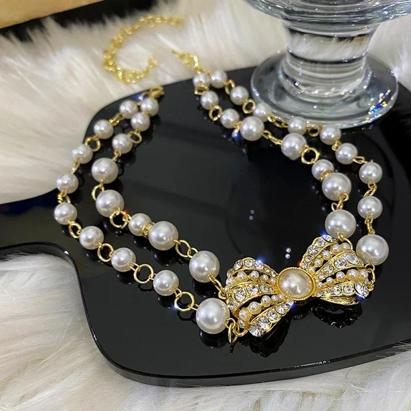 Fasjonabel dobbeltlags perleinnlagt diamant sløyfe kragebeinskjede INS retro high-end følelse utsøkt og elegant halskjede