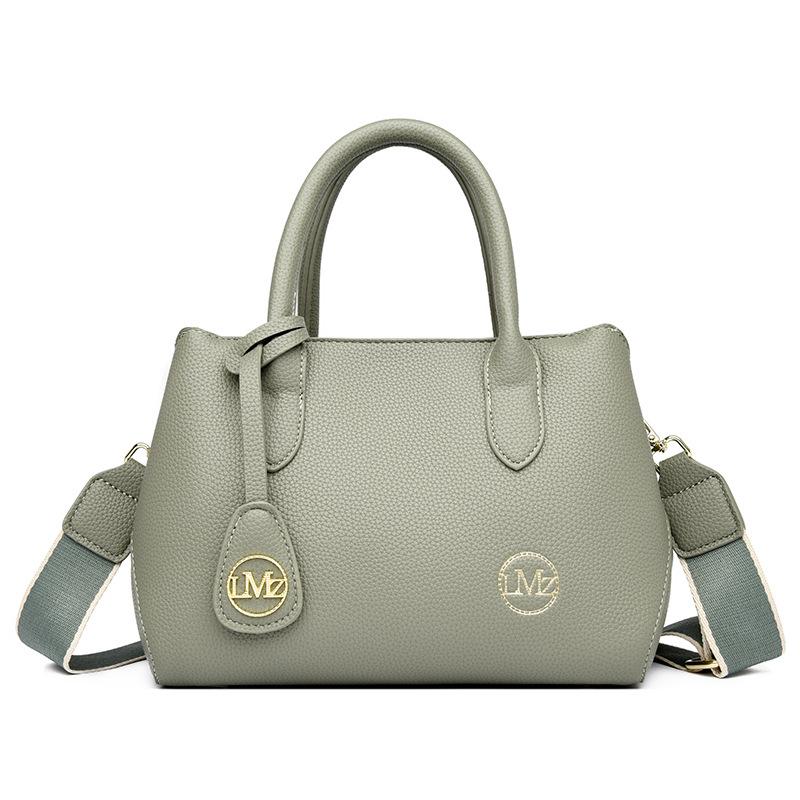 

Simple soft leather mother messenger bag trendy 2025 new versatile women s large-capacity fashion shoulder bag multi-layer women s bag світло-зелений колір