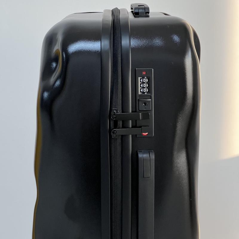 Embossed Italian 20" Carry-on Suitcase with Universal Wheels and Customizable Lock.