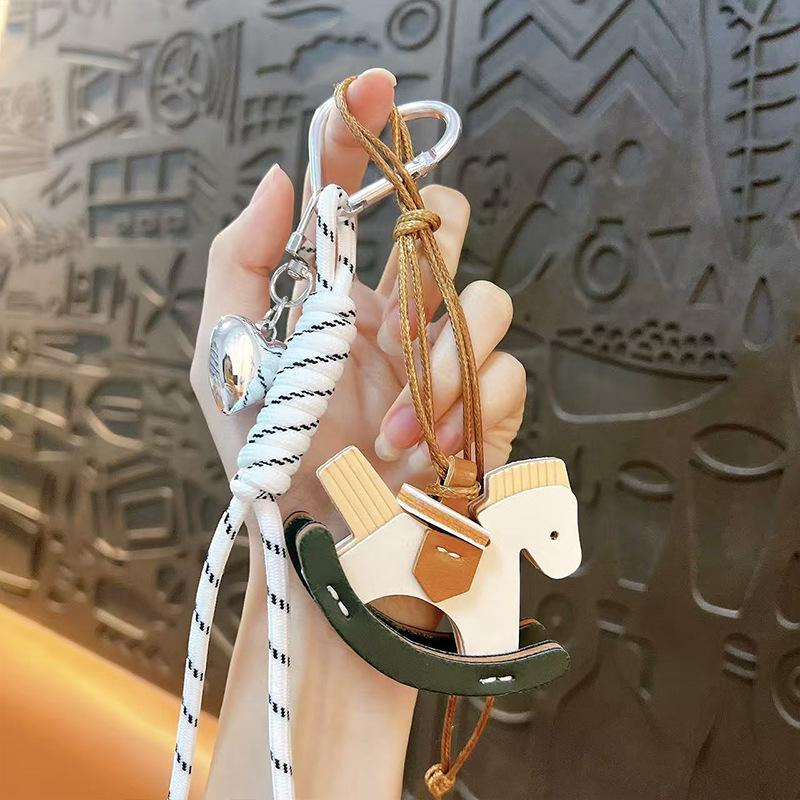 Creative leather rocking horse keychain cute trendy cool PU Trojan horse pendant men and women versatile bag hanging accessories small gifts