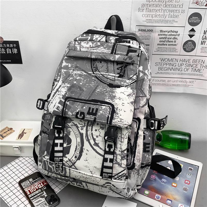 Autumn new fashion schoolbag female personality camouflage graffiti couple backpack large capacity student backpack male