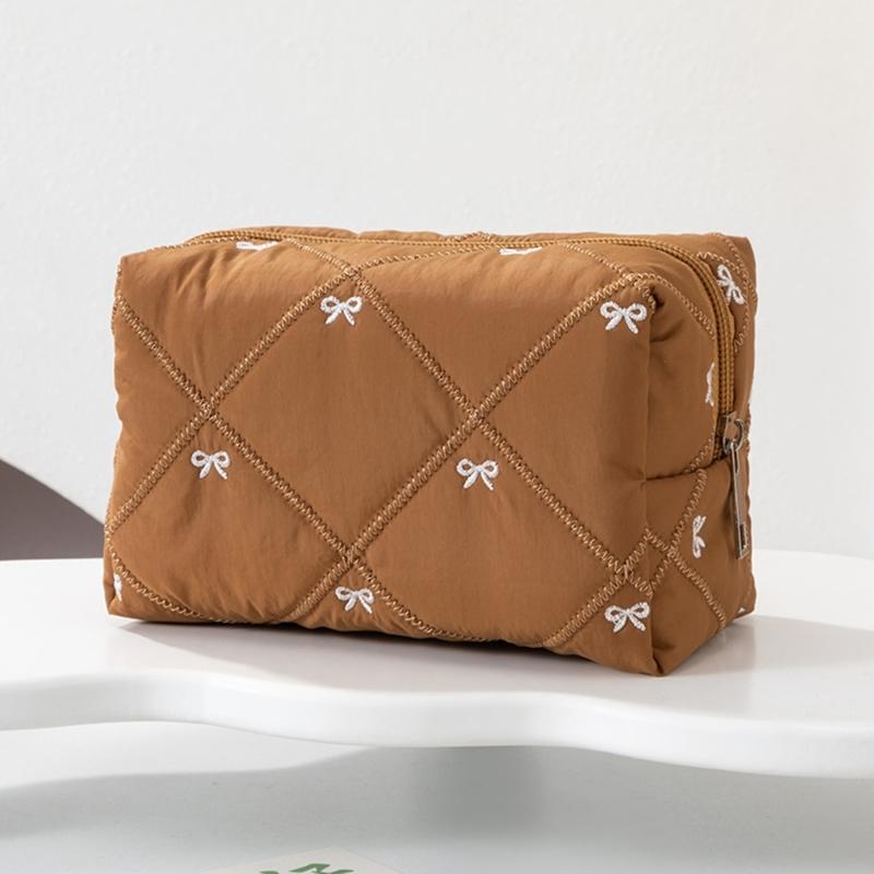 Large Capacity Makeup Organizers with Quilted Bowknot Accent and Multiple Divisions for Efficient Travel