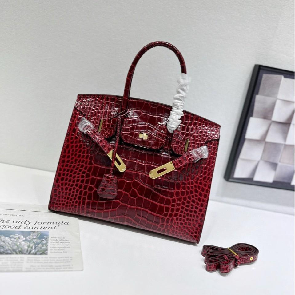 

Cross-border exclusive platinum outer stitching crocodile pattern European and American two-layer cowhide one-shoulder cross-body handbag leather bag 30CM рожевий червоний колір