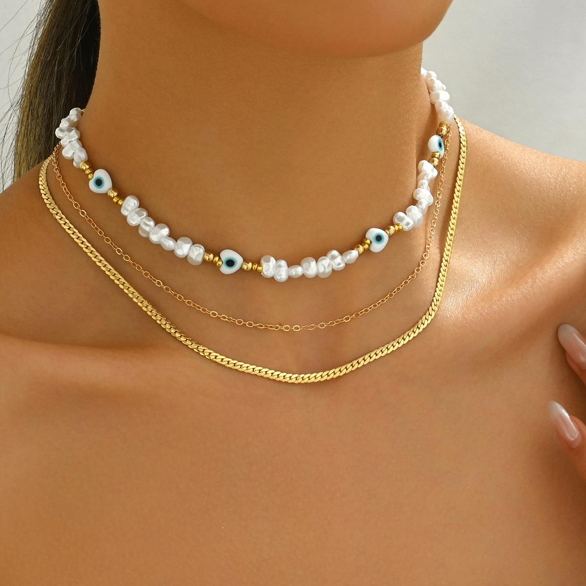 

2025 ветер новое ожерелье комплект из трех предметов женское инкрустированное жемчугом ожерелье с цепочкой на ключицу дизайн любви