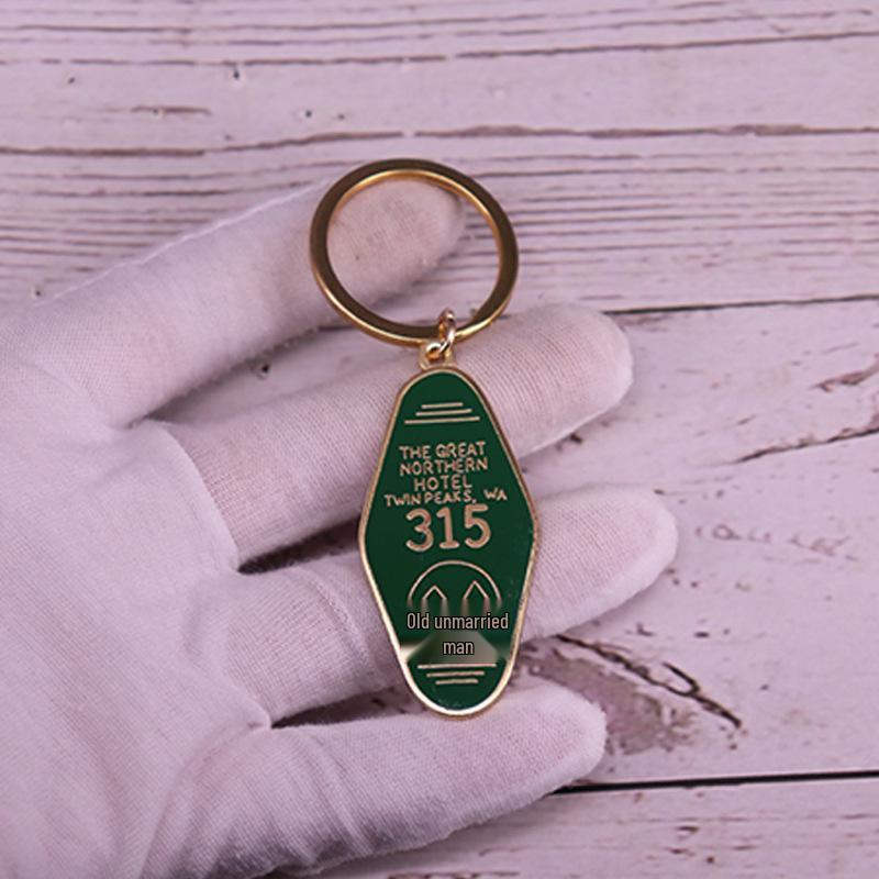 

Double Peak 315 TV Series Keychain золотой