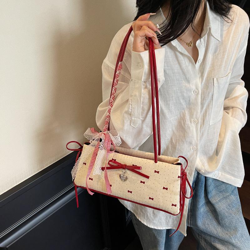 Modische vielseitige süße Schleife Achseltasche Damen 2025 Sommer schlichte Nische hochwertig einzelne Schulter Handtasche