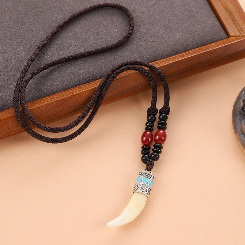 Retro woven dog tooth necklace men's and women's long niche personalized wolf tooth pendant pendant sweater chain accessories