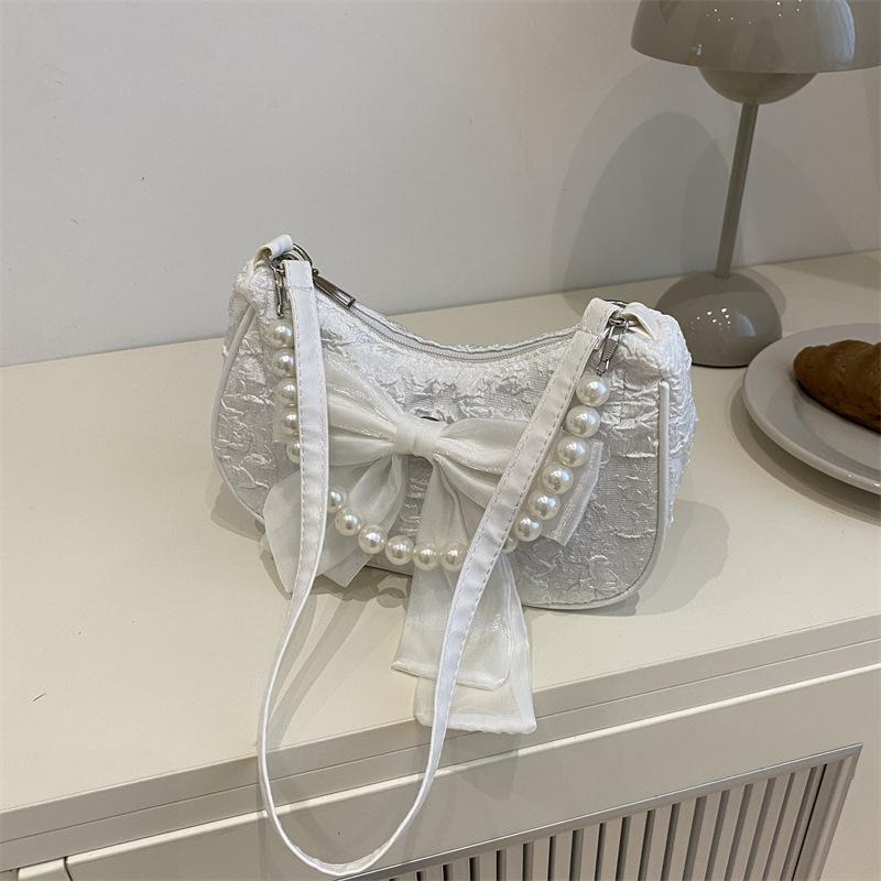 Popular design pearl handbag bag women's summer new messenger bag bow shoulder armpit bag