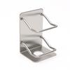 Stainless steel toothpaste holder (silver) with attached toothpaste holder